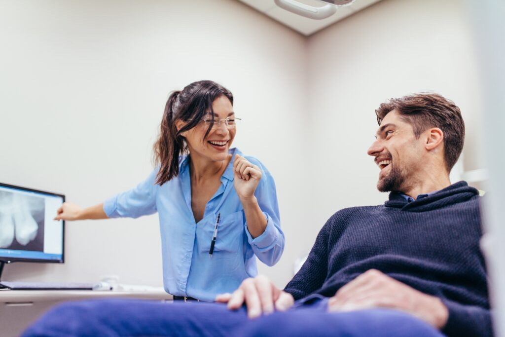 Propel Orthodontics patient and doctor laughing